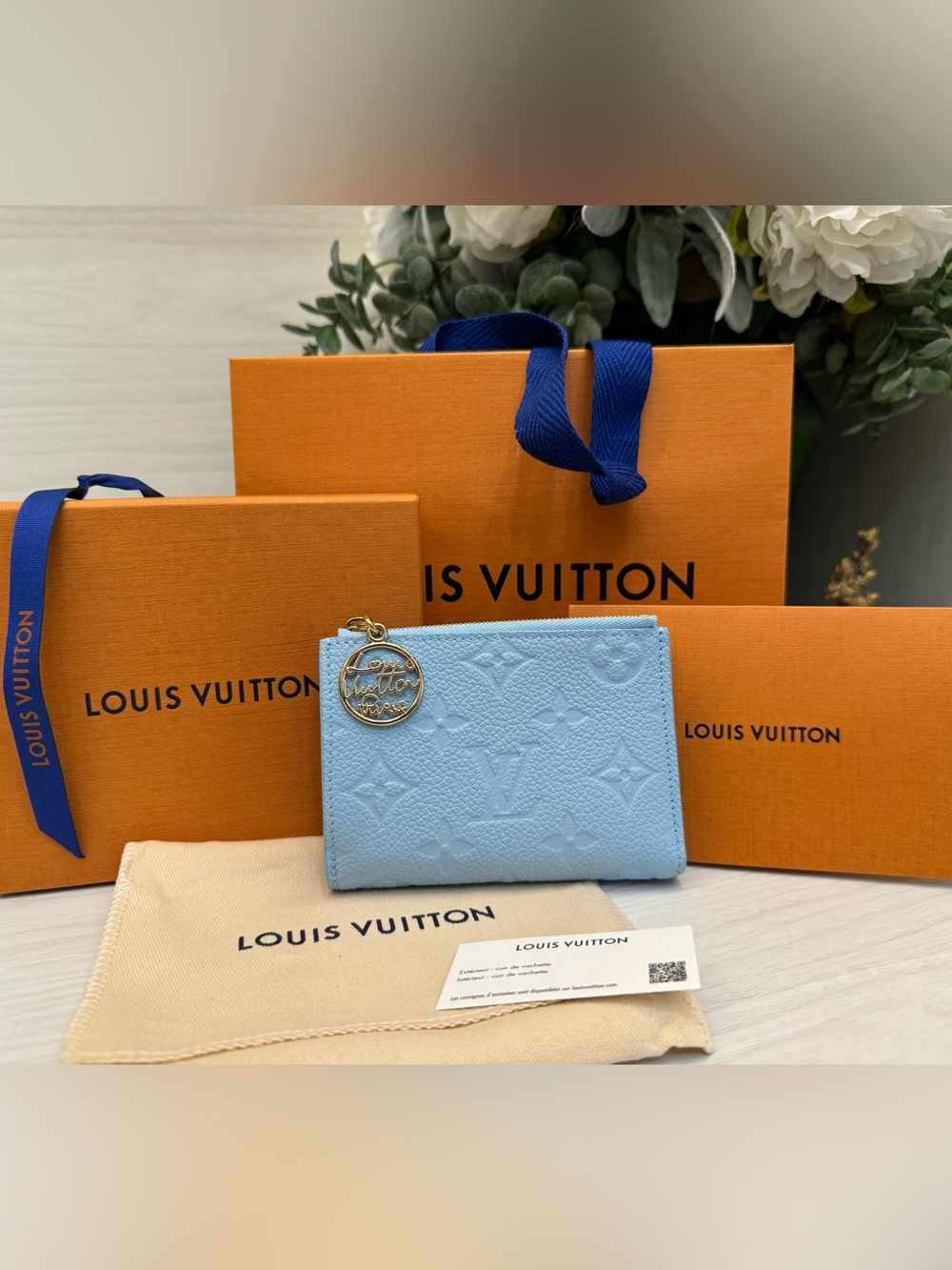 Louis Vuitton (NWT) Portefeuille Lisa in Monogram Empreinte leather (Light Blue)